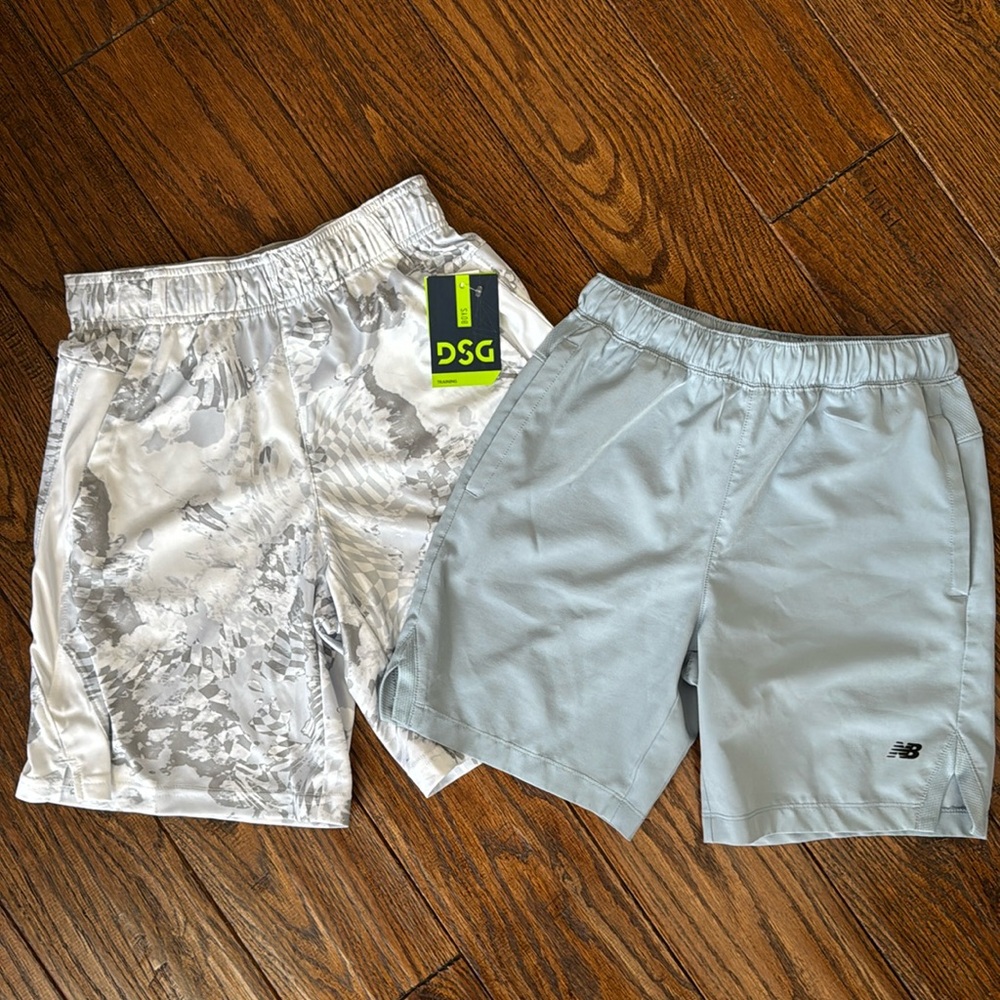 Set of 2 boys shorts, size Medium. DSG ones are NWT. Lt blue are New Balance